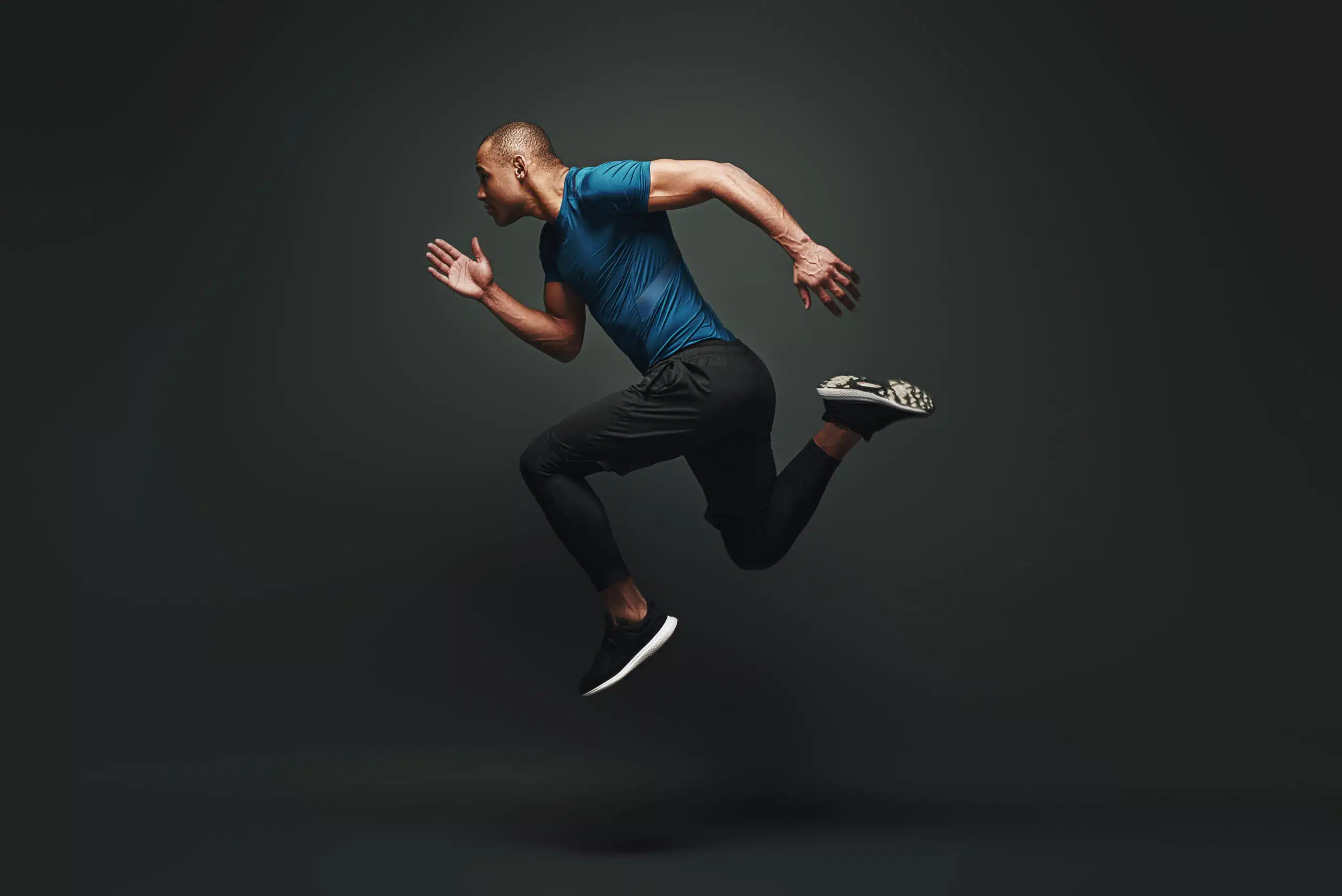 Home 1 jump higher sportsman jumping over dark background 2023 11 27 05 36 38 utc 1 scaled